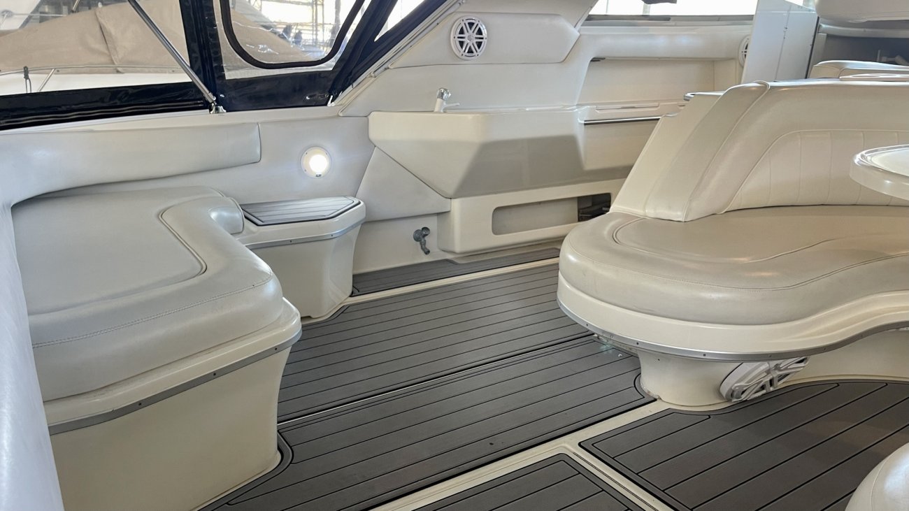 V-drive engines set close to the transom.  The propeller shaft exits the engine forward to the transmission. The transmission then redirects the shaft aft towards the propeller.  The shaft forms a V in and out of the transmission