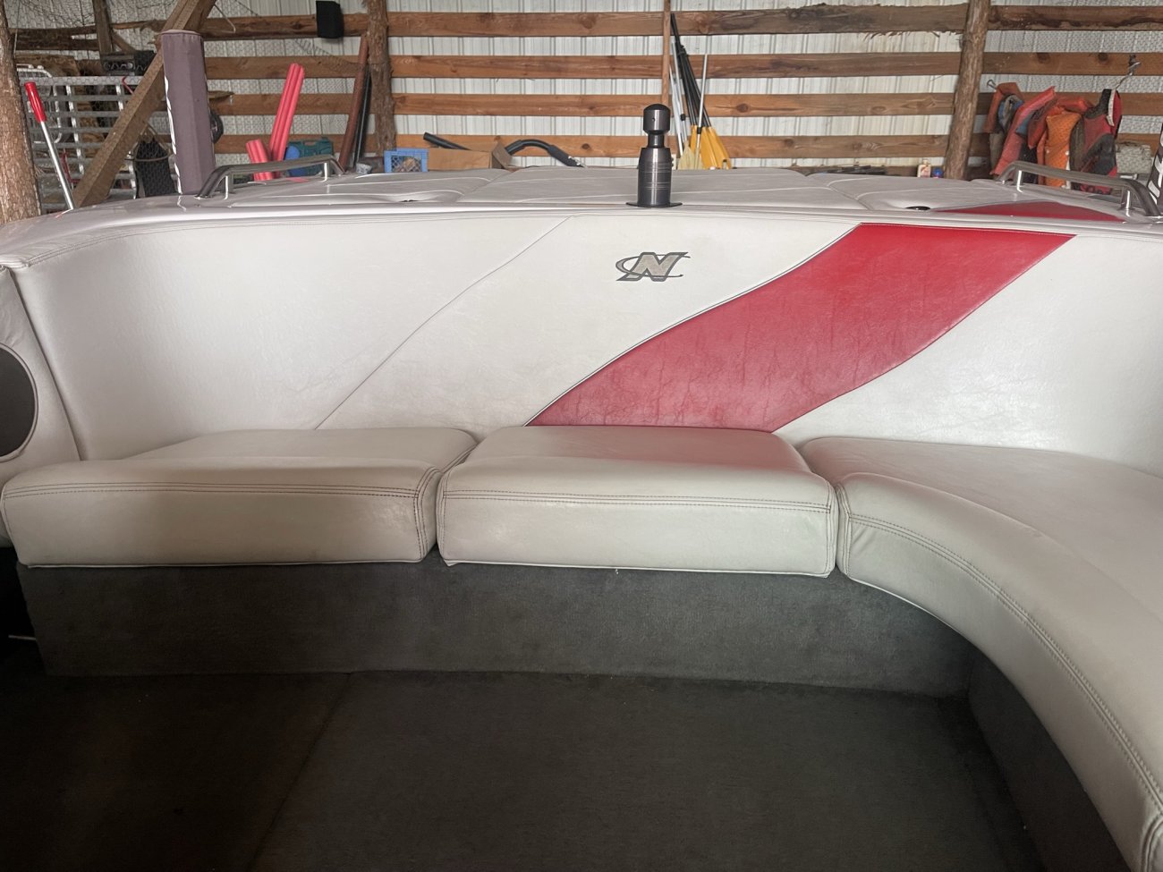V-drive engines set close to the transom.  The propeller shaft exits the engine forward to the transmission. The transmission then redirects the shaft aft towards the propeller.  The shaft forms a V in and out of the transmission