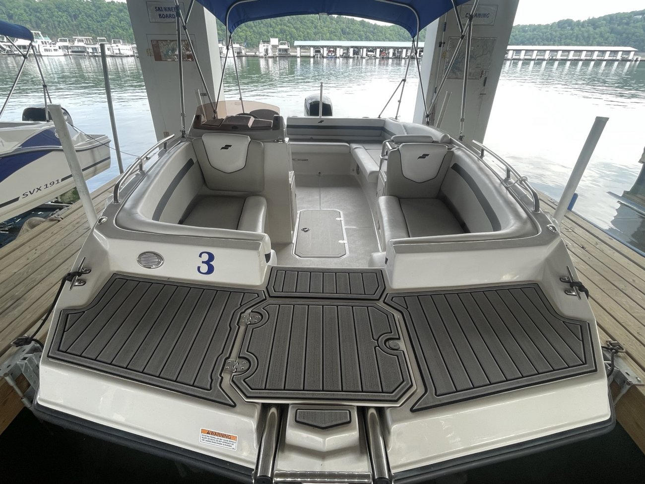 Glass fibers either loose or woven, reinforced with resin and used in the construction of many boats.