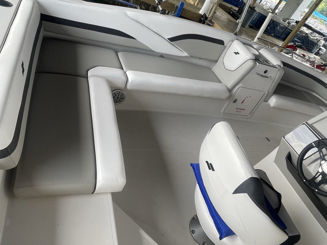 The deckboat is a cross between a bowrider and a pontoon boat.  It features a rather flat deck area with lots of room for people while still offering the speed and agility of a runabout.