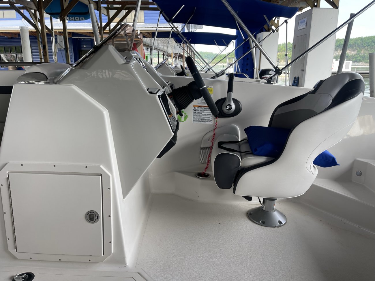 The definition of an outboard motor is a detachable engine mounted on outboard brackets on the stern of your boat.  This configuration will have only one single engine.