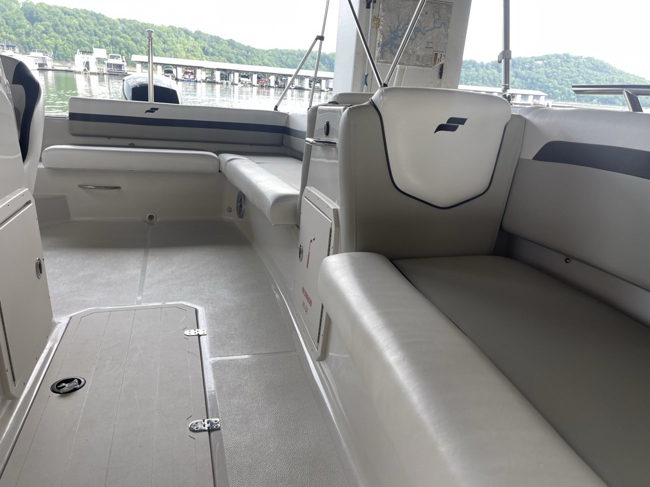 The deckboat is a cross between a bowrider and a pontoon boat.  It features a rather flat deck area with lots of room for people while still offering the speed and agility of a runabout.