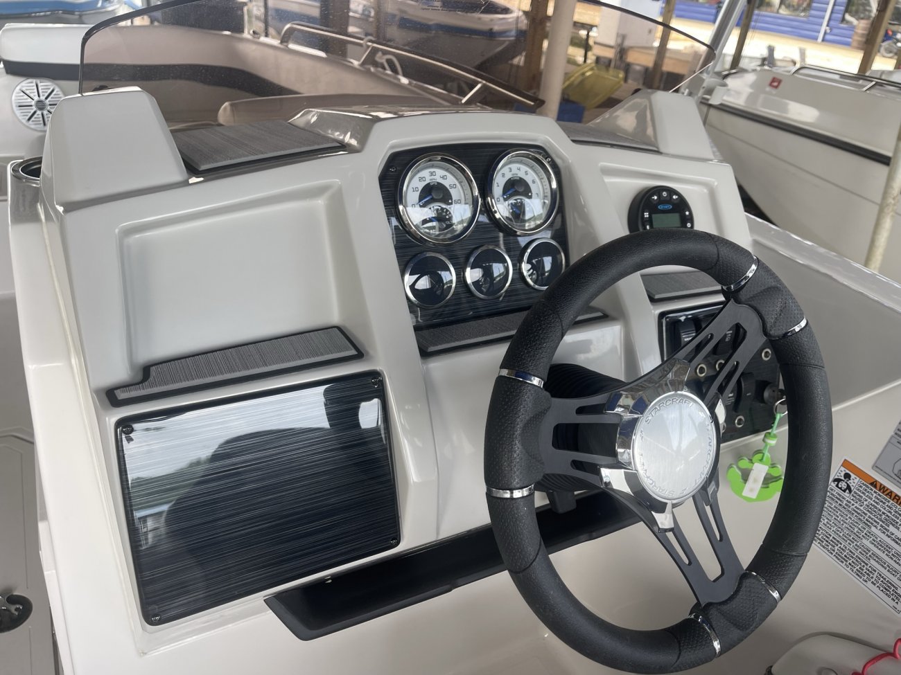 The deckboat is a cross between a bowrider and a pontoon boat.  It features a rather flat deck area with lots of room for people while still offering the speed and agility of a runabout.
