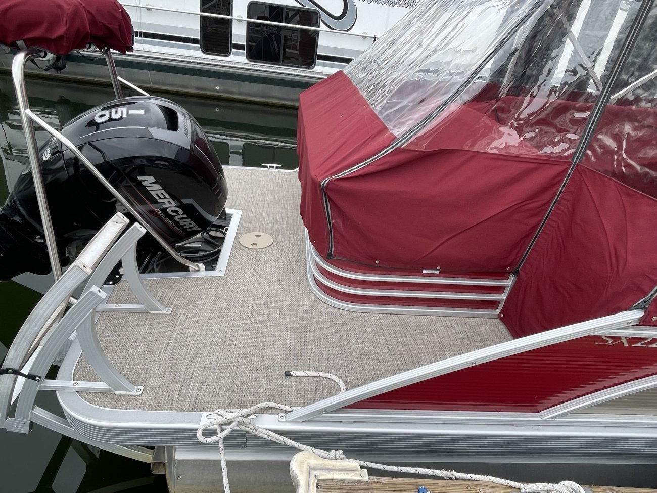 The definition of an outboard motor is a detachable engine mounted on outboard brackets on the stern of your boat.  This configuration will have only one single engine.