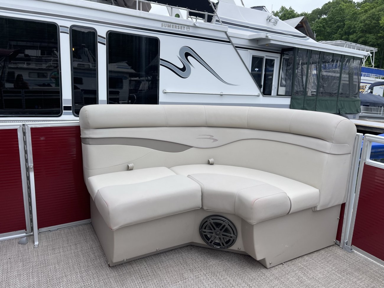 The definition of an outboard motor is a detachable engine mounted on outboard brackets on the stern of your boat.  This configuration will have only one single engine.